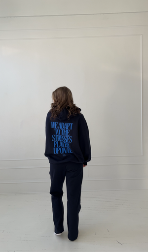 WE ADAPT TO THE STRESSES PLACED UPON US HOODIE